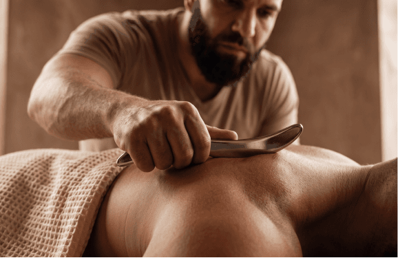 Myofascial release and trigger point therapy with a Graston tool